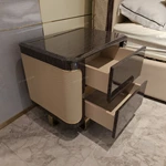 Dark Glossy Nightstand with Woven Leather Side Panels and Hidden Drawer Pulls